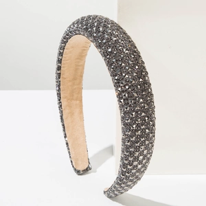Macro shot of thick baroque headband featuring grey square crystals and velvet lining