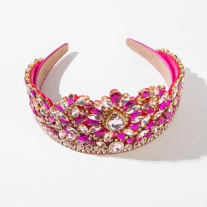 Macro detail of luxury baroque headband with pink crystals and golden metal inlay