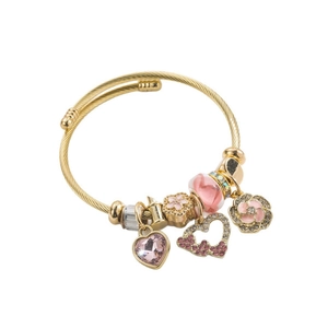 Gold-plated wire wrap bangle with pink heart crystal and floral enamel charms