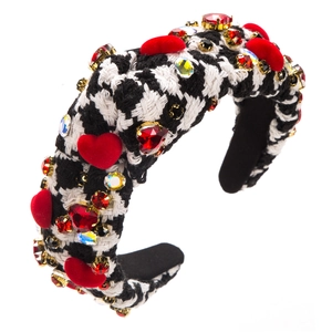 Detail of sponge headband with houndstooth pattern, red flocking hearts and rhinestones