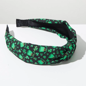 Detail of St. Patrick's Day knotted headband with green shamrock and Irish hat print