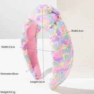 Gedetailleerde afmetingen van de roze pailletten hoofdband met knoop en kleurrijke glitter