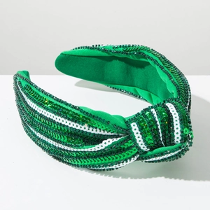 Detail of green and white sequined knotted headband for St. Patrick's Day celebration
