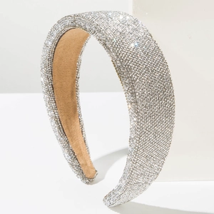 Detailed view of silver rhinestone headband featuring plush khaki non-slip velvet lining