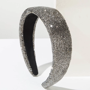 Detail of gray crystal rhinestone headband with thick sponge padding and black fabric lining