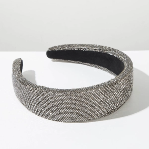 Macro detail of padded headband featuring dense grey rhinestones with a luxury finish