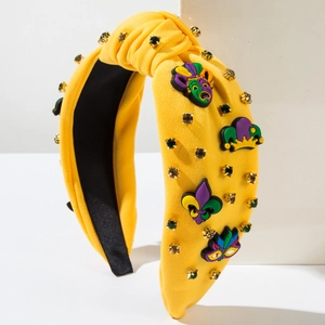 Détail du serre-tête jaune Mardi Gras avec strass colorés et ornements de fête