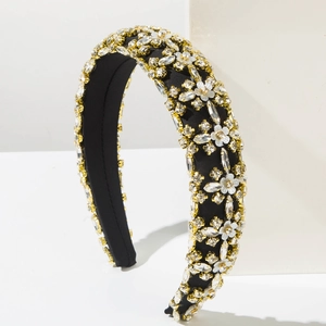 Detailed macro view of luxury padded headband with crystal rhinestones and white floral accents