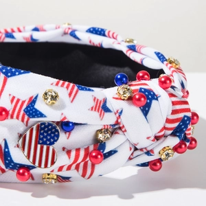 Detail of USA flag heart charm with pearls and rhinestones on knotted fabric headband