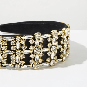 Close-up of baroque velvet headband with luxury sparkling rhinestones and golden claws