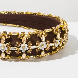 Detail of vintage padded headband with amber crystals and floral embellishments