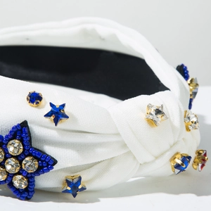 Detail of white knotted headband with blue bead stars and crystal rhinestone embellishments