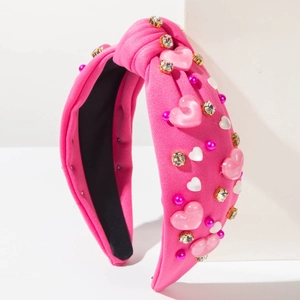 Serre-tête large noué rose avec ornements en résine de cœur et perles serties