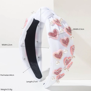 White knotted wide headband with pink rhinestone hearts and faux pearls dimensions shown