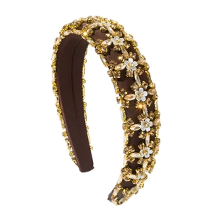 Vintage padded headband featuring sparkling rhinestones and white flower decorations