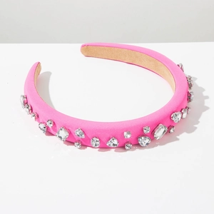 Detail of hot pink satin headband featuring multi-shape crystals and heart rhinestones