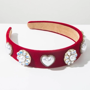 Detail of red velvet headband featuring heart pearls and rhinestones on anti-slip lining