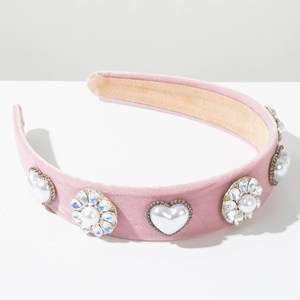 Detail of pink velvet headband with pearl hearts and rhinestone floral embellishments