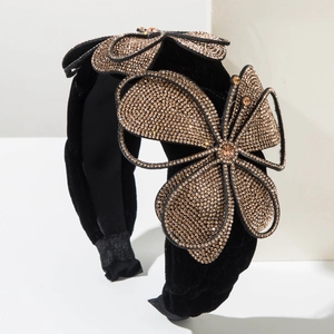 Luxurious wide black velvet headband featuring large champagne gold rhinestone butterflies