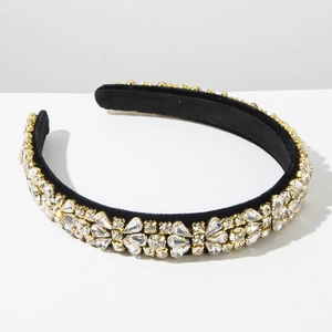 Close-up of luxury Baroque headband with gold-plated claws and sparkling crystals