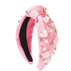 Serre-tête rose noué avec cœurs, strass et perles pour la fête des amoureux