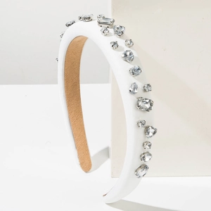 Elegant white padded headband with sparkling multi-shape crystals and heart rhinestones