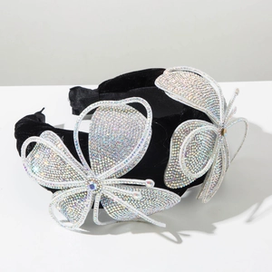 Macro shot of hand-woven velvet headband featuring two oversized sparkling diamond butterflies