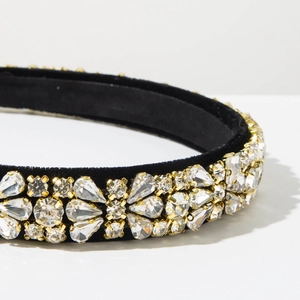 Detail shot of vintage baroque headband with full rhinestones on black velvet
