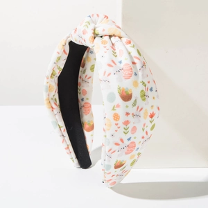 Detail view of knotted Easter headband featuring colorful bunny and egg fabric patterns