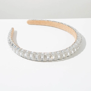 Macro detail of the sparkling rhinestones and soft velvet lining of the silver headband