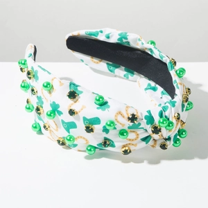 Detail of St. Patrick's Day headband with green rhinestones and clover patterns