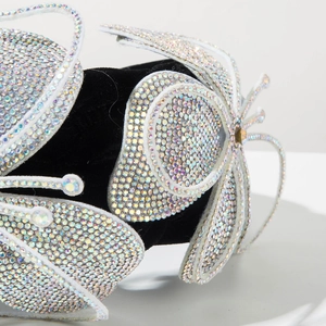 Close-up of sparkling colorful rhinestones on a butterfly velvet headband detail