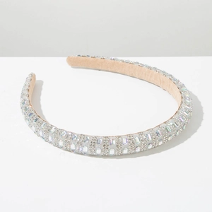 Detail view of rhinestone headband with holographic crystals and soft beige velvet lining
