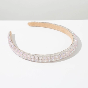 Detail of handmade padded headband with sparkling AB rhinestones and beige velvet lining