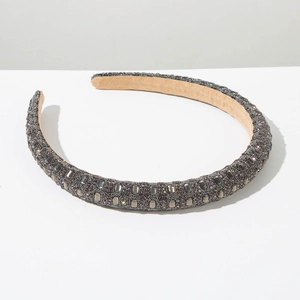 Close-up of sparkling dark grey rhinestone headband with soft velvet inner lining