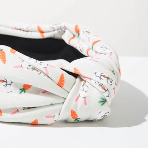 Detail of knot structure on fabric headband with rabbit and carrot patterns