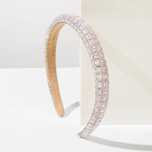 Detailed close-up of slim headband with multi-color rhinestones and non-slip lining