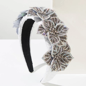 Close-up of Baroque headband with sparkling rhinestones and elegant grey floral details