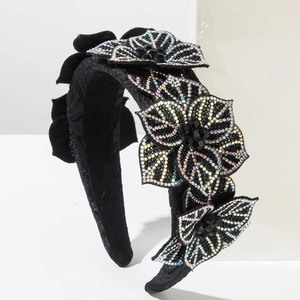 Detailed close-up of luxurious baroque headband with colorful rhinestone floral patterns