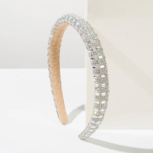 Detail of sparkling full rhinestone headband with crystal embellishments and velvet lining