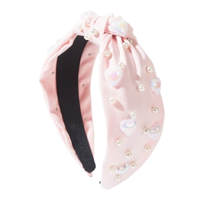 Serre-tête noeud en tissu rose avec perles nacrées et perles de coeur irisées