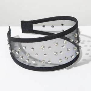 Detailed macro view of black mesh headband featuring silver studs and sparkling rhinestones