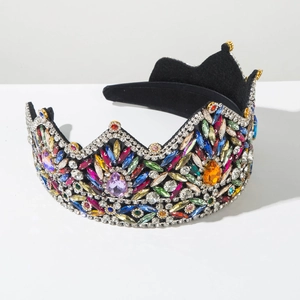 Detailed close-up of Baroque crown headband with multi-colored crystals on black velvet base