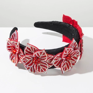 Close-up of elegant red velvet flower headband with shimmering rhinestones for parties