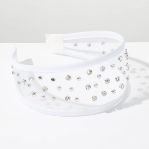 Close-up of white mesh headband with transparent rhinestones and silver sequins details