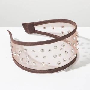 Detail of brown mesh headband with sparkling rhinestones and silver metal studs