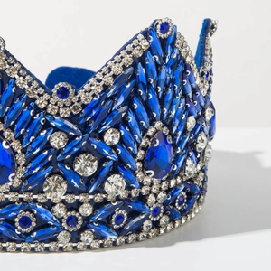 Detail of luxury baroque crown with blue teardrop crystals and silver metal plating