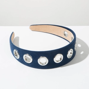 Detail of navy velvet headband with silver metal grommets and anti-slip lining