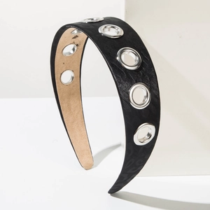 Retro wide black headband with leopard texture and silver metal eyelets on white block