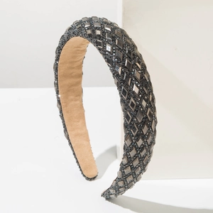 Detail of wide padded headband with dark grey rhinestones and anti-slip lining